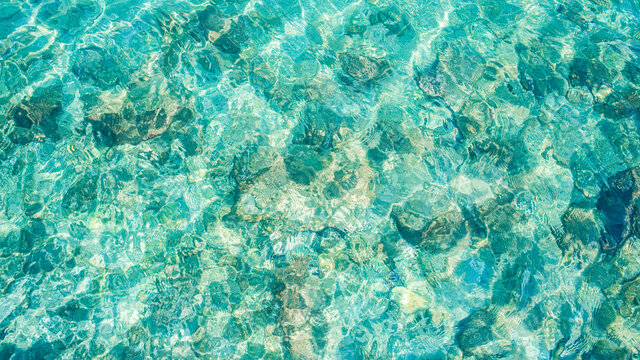 sea water transparent turquoise surface top view from above