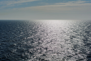 Seascape in the Baltic sea with glowing solar path. Sun glare on the sea surface. The glow of the...