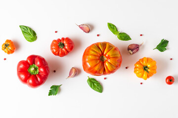 Organic vegetables composition. Tomato, basil, spices, pepper, garlic on white background. top view. flat lay. Vegan food