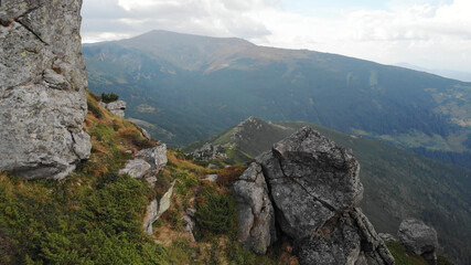 Huge stone boulder. Lovely mountain landscape.