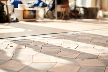 The combination of ceramic tiles in the form of rhombus. Kitchen renovation. Freshly glued High-quality Italian tiles
