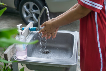 Wash your hands with corona anti-virus soap for good hygiene.