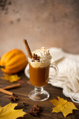 pumpkin latte with whipped cream and cinnamon