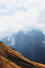stone and grassy landscape. mountains