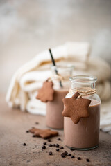 chocolate milk with cookies and warm knitted scarf