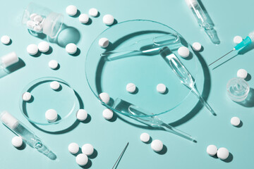 Pharmaceutical drugs on the green background, concept of complex treatment