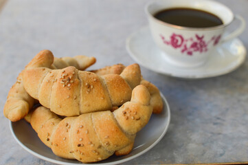 Traditional Serbian homemade rolls(kiflice) with cup of coffee