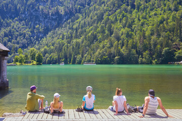 Impressions at „Kings lake“, Germany, Bavaria, with tourists on the shore.