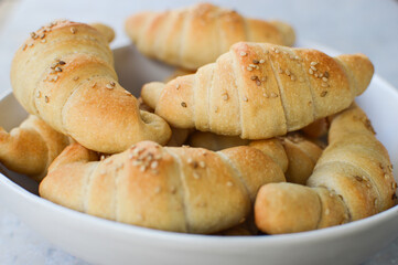 Traditional Serbian homemade rolls(kiflice) in the white bowl, close up