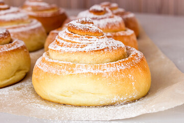 Soft, fluffy buns sprinkled with powdered sugar