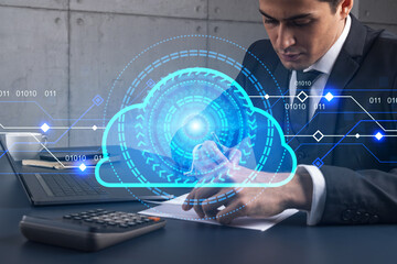 A businessman in office taking notes using phone and storage cloud hologram. Multiexposure. Formal wear.