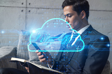 A businessman in office taking notes using phone and storage cloud hologram. Multiexposure. Formal wear.