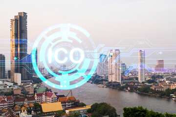 ICO icon hologram over panorama city view of Bangkok, the hub of blockchain projects in Asia. The concept of initial coin offering. Double exposure.