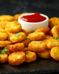 Mini hash browns, tater tots crispy golden potato bites served with jalapeno peppers dipped in ketchup
