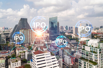 IPO icon hologram over panorama city view of Bangkok, the hub of initial public offering in Asia....