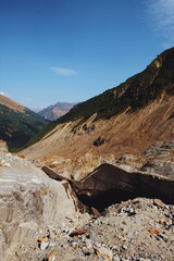 view of mountains and forest on a sunny summer day.