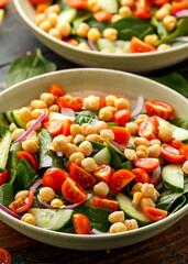 Chickpeas salad with tomato, cucumbers, red onion and greens. Dietary food. Vegan salad.