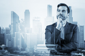 Young handsome businessman in suit with hand on chin thinking how to succeed, new career opportunities, MBA. Singapore on background. Double exposure.