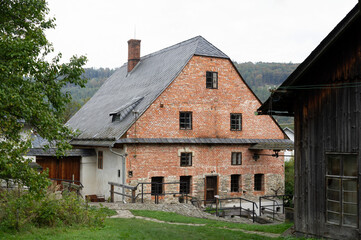 Fototapeta na wymiar Wesselsky watermill (Vodni mlyn Wesselsky), Odry, Czech Republic / Czechia - building of historical water mill. House and cottage in village, rural area and countryside. 