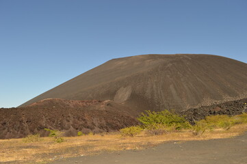 Hiking and snowboarding in the volcanic ashes on the Nicaraguan Volcanoes outside of Léon, Central America