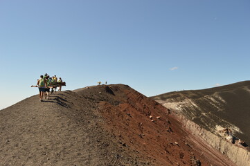 Hiking and snowboarding in the volcanic ashes on the Nicaraguan Volcanoes outside of Léon, Central...