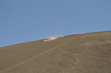 Sand boarding and sleighing in the volcanic ashes of the volcanoes of Léon in Nicaragua