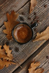 Espresso coffee and oak leaves on the table 