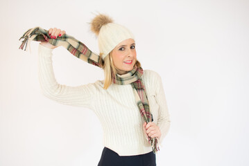 Happy Young Beautiful Woman in winter clothes on white background with copy space. Sales and discount concept