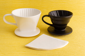 Drip brewed  coffee on yellow background 