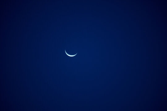 Crescent moon in sky.