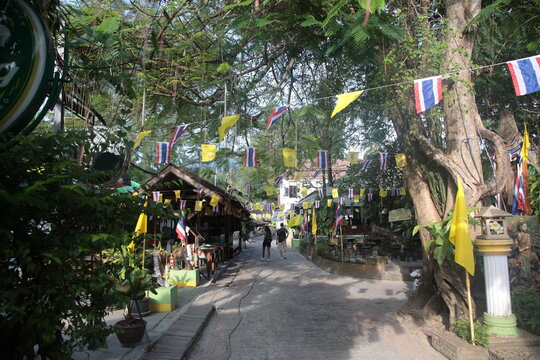 Street view of Tonsai bay pier with restaurants and bars in Phi Phi island,  Krabi province, Thailand