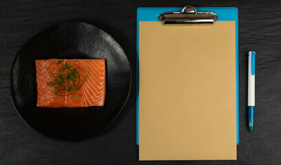 Slices of Raw Salmon Fillet on Black Background Mockup Top View