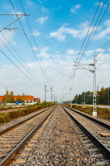 Fototapeta na wymiar Two lane railroad with electric power lines