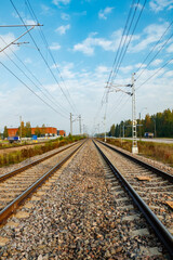 Obraz premium Two lane railroad with electric power lines