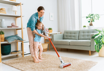 family cleaning the room