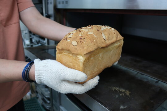 Many Hot Just Baked Bread On A Rack.