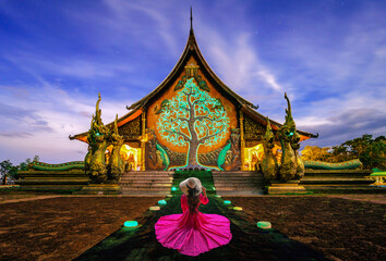Thai woman visit Amazing glow Temple at  Sirindhorn wararam phu prao temple or Wat phu prao at...