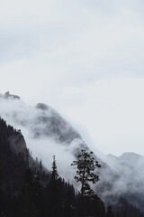 view of the mountains on a foggy cloudy rainy day