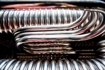 Abstract industrial background of metal pipes construction.