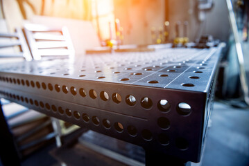 Metal welding table with mounting brackets at metal manufactory