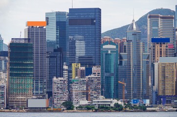 Boat and ship traffic in bay of Victoria Harbor Hong Kong, China with city skyline in background...