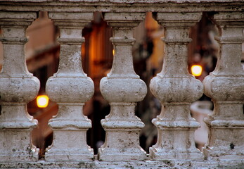 Urban evening view through the stone balustrade - horizontal
