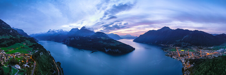 Night panorama of the canton Schwyz, Lake Lucerne. City Brunnen and Morschach. Night lights. Aerial view.