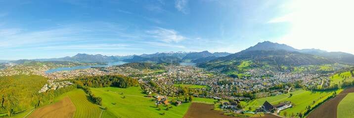 Wide panorama of the canton of Lucerne. Switzerland. Pilatus peak. Aerial view. City skyline and village landscape