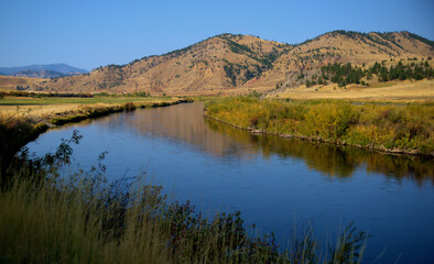 Fototapeta na wymiar Reflections and autumn colors in Western Montana.