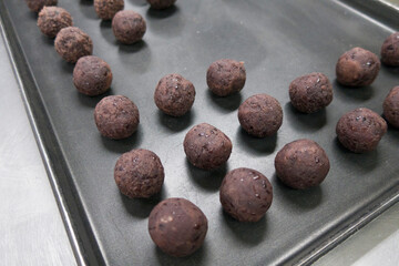 sweet red beans served in black tray.