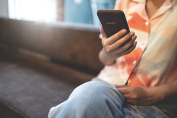 Woman using mobile smart phone at cafe, online shopping, surfing internet.