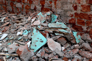 view of demolish construction site with broken wall and wastage