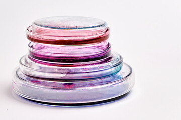 Pyramids from Petri dishes with colorful agar media with bacterial colonies for biochemical...