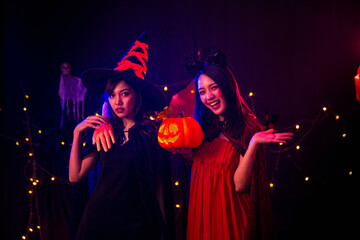 Two young women at Halloween. Halloween festival